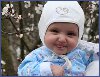 Кенхинская девочка Амаль, которой 5 месяцев, и которая хитро и стеснительно улыбаясь нам, как бы говорит «Люди я тоже пришла в этот мир, к Вам»