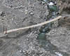 Suspension bridge through small river Tindinka.