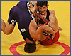 Omer Cubukci of Turkey (red) and Makhach Murtazaliev в квалификационном раунде. Афины 2004